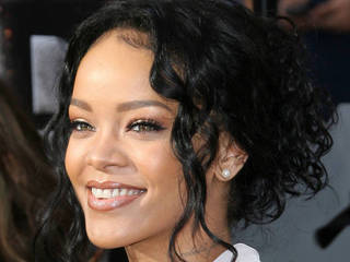 Rihanna settles legal battle with former...
